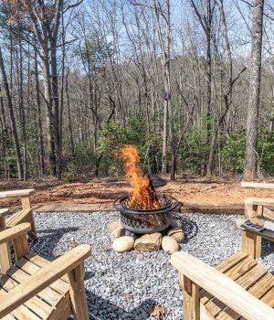 Forest fire pit area for romantic mountain getaways